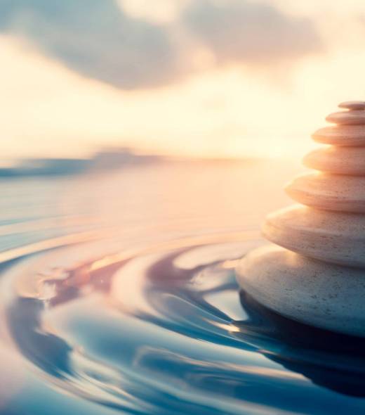 Mindfulness and meditation background. Zen rocks on water at sunset. 3D render